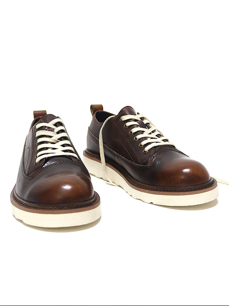 Brown leather lace-up shoes with white soles, minimalist design, premium handcrafted footwear