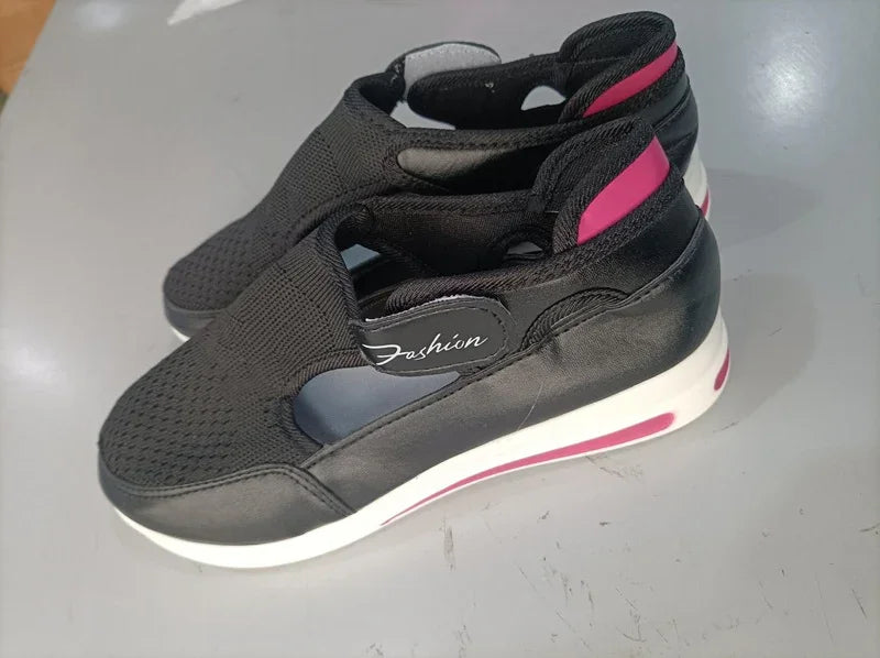 Black and pink fashion sneakers with mesh upper and white sole, minimalist design