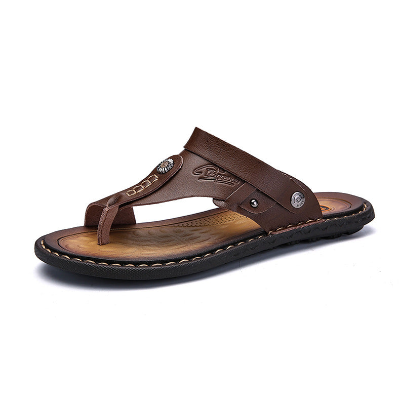 Brown leather thong sandal with decorative stud and stitched sole, minimalist design