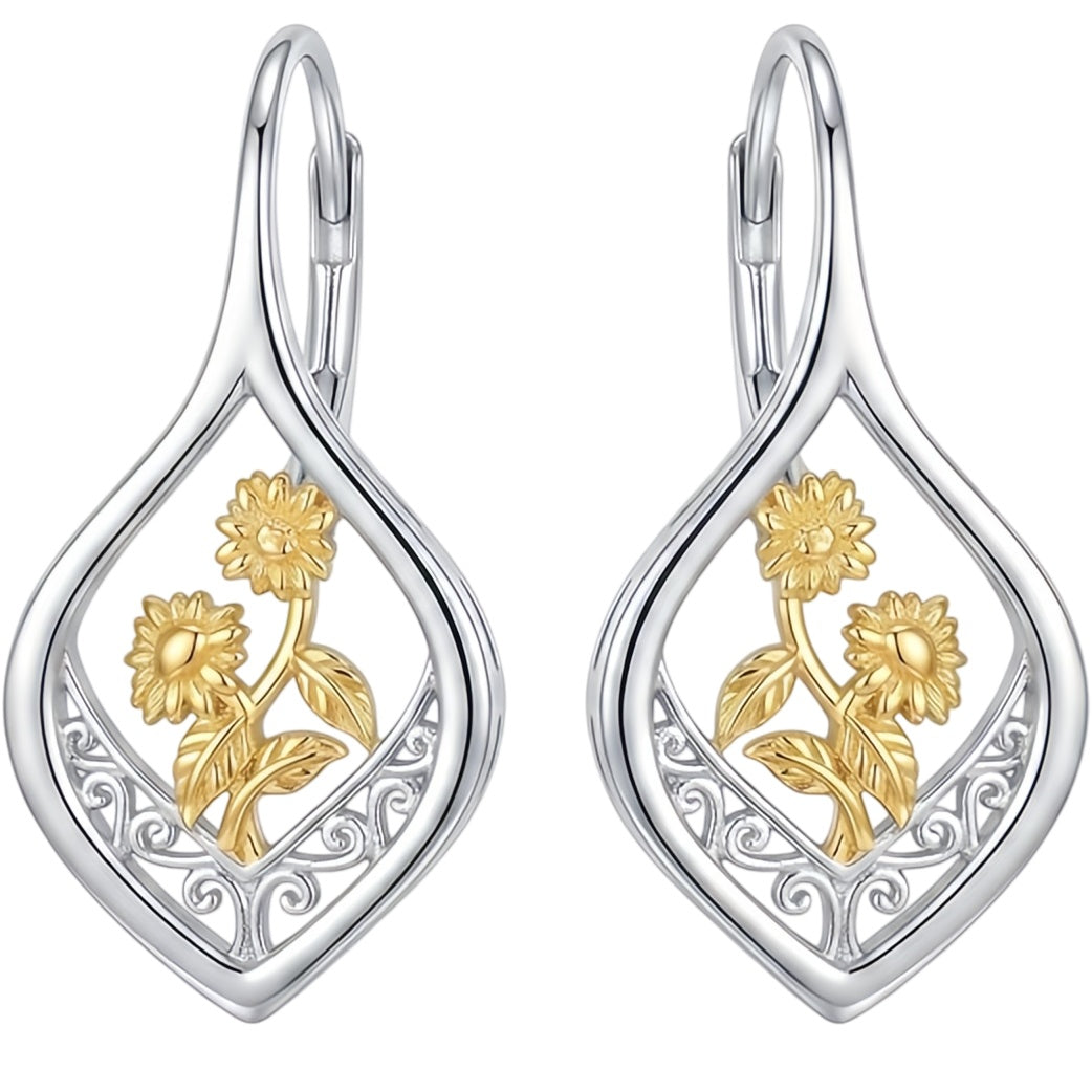 Silver drop earrings with gold filigree sunflower detail, on white background