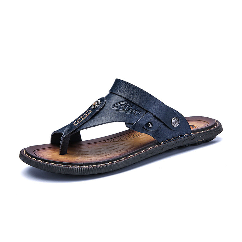 Men's navy leather thong sandal with stitched sole and metallic accents, minimalist design