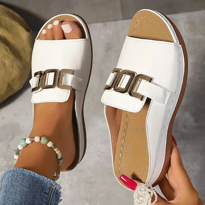 White minimalist slide sandals with gold buckle, handcrafted footwear, luxury design