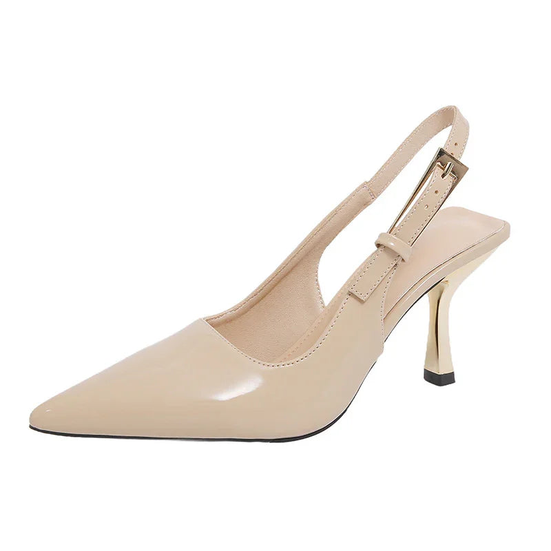 Beige patent leather pointed-toe slingback heels with gold heel