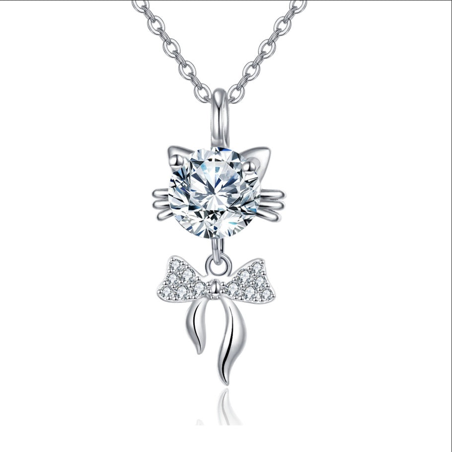 Cat-shaped pendant necklace with sparkling bow charm and round crystal, minimalist luxury jewelry