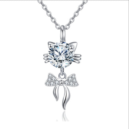 Cat-shaped pendant necklace with sparkling bow charm and round crystal, minimalist luxury jewelry