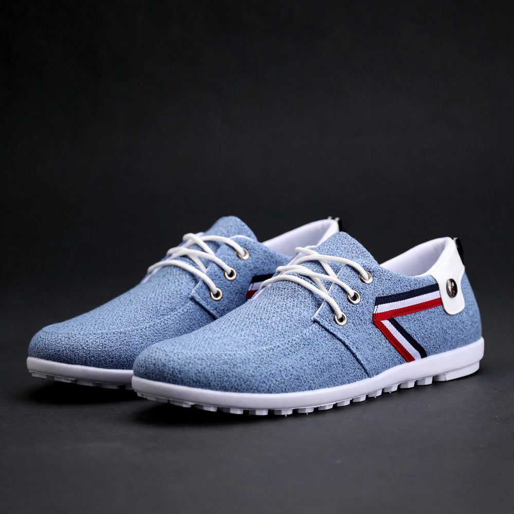 Blue canvas lace-up shoe with side stripe, luxury product photography
