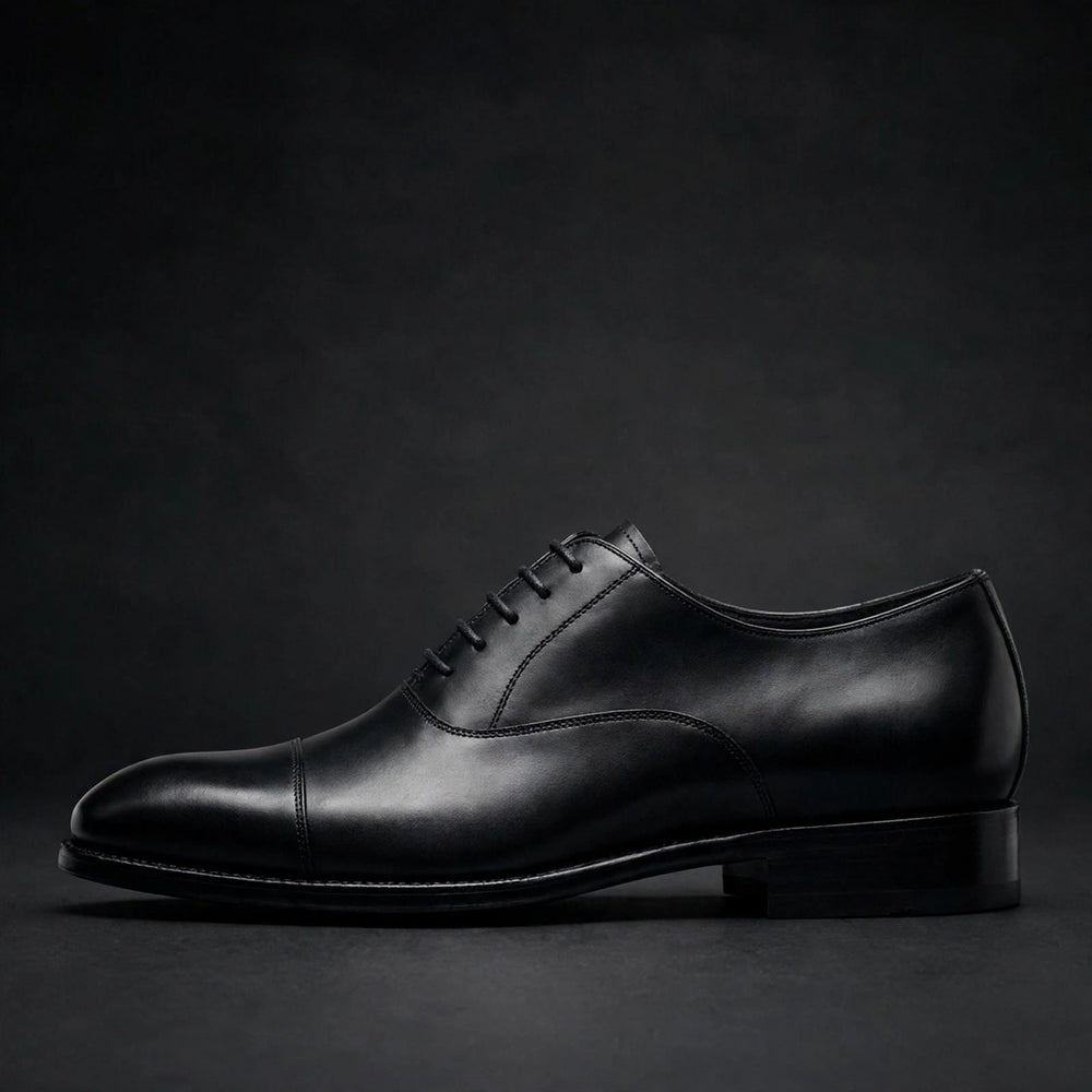 Men's black leather dress shoe, dark luxury product photography